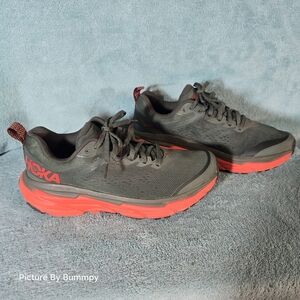 Hoka Challenger ATR 6 trail running shoes in a grey/dark sage green and orange
